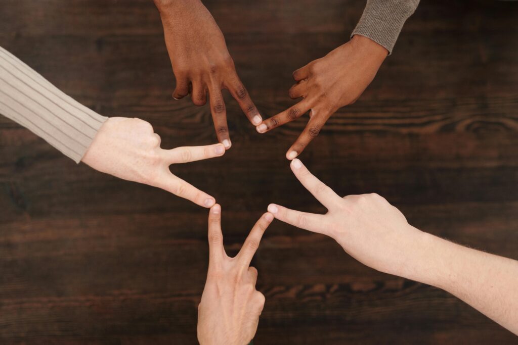 Group of people in a supportive circle symbolizing a motivational support network.
